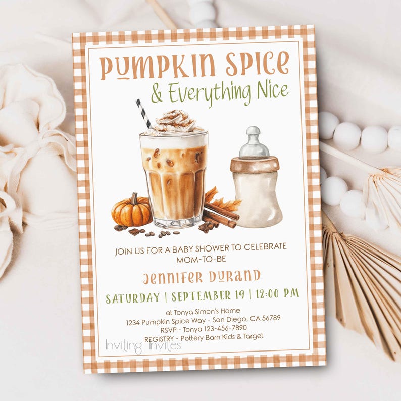 May include: A baby shower invitation with a fall theme. The design features a pumpkin spice latte, a baby bottle, and a small pumpkin. The text reads "Pumpkin Spice & Everything Nice" and includes event details.