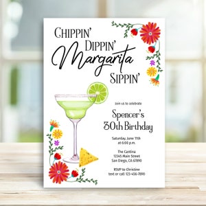 May include: A white invitation with colorful floral designs and a margarita glass with a lime wedge. The text reads "Chippin' Dippin' Margarita Sippin'" and "Join us to celebrate Spencer's 30th Birthday". The invitation includes the date, time, location, and RSVP information.