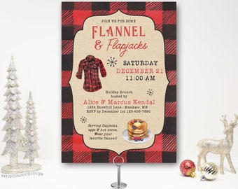 May include: A red and black plaid invitation for a flannel and flapjack brunch. The invitation features a drawing of a flannel shirt and a plate of pancakes with berries. The text reads "Join us for some Flannel & Flapjacks, Saturday December 21, 11:00 AM, Holiday Brunch hosted by Alice & Marcus Kendal, 1234 Snowhill Lane/Mankato, MN, RSVP by December 1st 123-456-7890, Serving flapjacks, eggs & hot cocoa. Wear your favorite flannel!"