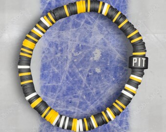 Pulsera unisex de colores del equipo de hockey de Pittsburgh: negro, amarillo y blanco.