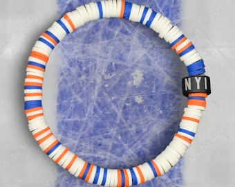 Pulsera unisex de colores del equipo de hockey de Nueva York: blanco, azul y naranja.