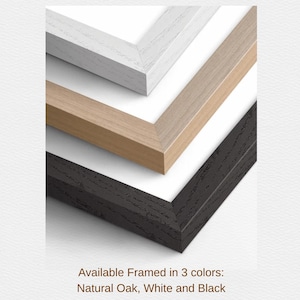 three different colored wooden frames, including natural oak, white, and black.