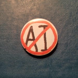 May include: A round button with the text "AI" crossed out by a red diagonal line. The text is in black, inside a white circle, with a red border. The button is on a dark blue surface.
