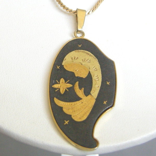 Vintage damascene cameo pendant on a gold tone Sarah Cov chain