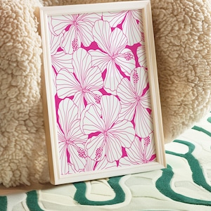 May include: A framed print with a white background and a pink floral pattern. The flowers are outlined in white and have a pink fill.
