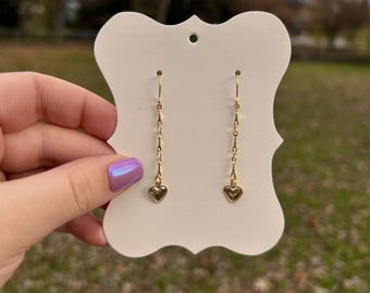 orecchini pendenti a forma di cuore in oro