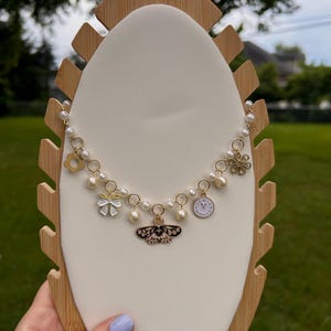 Fairy Tale Trinkets Necklace – Pearl Charm Necklace, Butterfly Clock Bow Pendant, Whimsical Gold Jewelry, Cottagecore Gift for Her