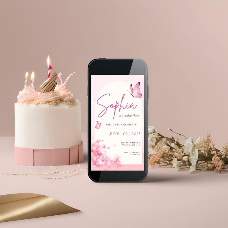 May include: A pink and white birthday invitation on a smartphone screen with a pink butterfly design and the text "Sophia is Turning Three" and "June 03 2025".