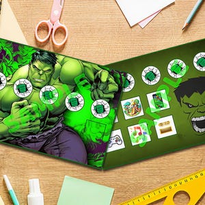 May include: A green and black game board with a picture of the Hulk on the front. The board has a grid of squares with different images in each square. The images include a phone, a game controller, a music note, and a picture of a park.