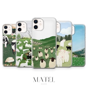 Pode incluir: Conjunto de cinco capas para telemóvel com diferentes ilustrações de ovelhas e vacas num campo. As capas são transparentes e têm uma borda branca. O texto "MATEL CASES" está impresso na parte inferior da imagem.