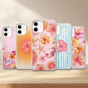 May include: Five clear phone cases with vibrant designs. The cases showcase floral, fruit, and marine life patterns, including hibiscus flowers, starfish, and seahorses. The cases are displayed on a wooden surface.
