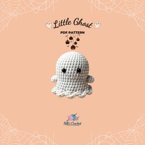 May include: A white crocheted ghost amigurumi toy with black eyes and a smiling mouth. The ghost is hanging from a string of orange pumpkins with jack-o-lantern faces. The text "Little Ghost PDF Pattern" is above the ghost.