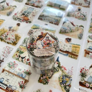 May include: A roll of decorative tape featuring a watercolor illustration of a cottage surrounded by flowers. The tape has the text "London Gifties Calm country, the quiet time". Various stickers with similar designs are scattered around the tape.