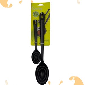 May include: Black portion spoons set with the text "PORTION SPOONS" and "LOOT LONDON". The spoons are on a green and yellow card. The spoons have different sizes for measuring ingredients.