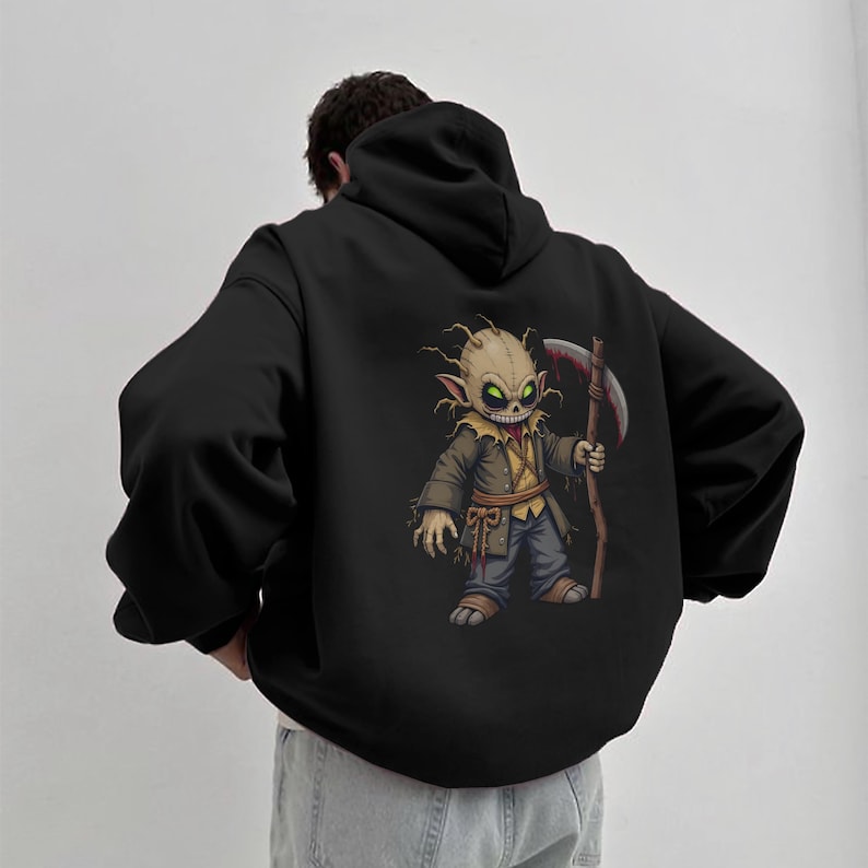 Dark horror hoodie featuring a chibi scarecrow reaper with glowing green eyes and a bloody scythe. This high-resolution PNG design is perfect for sublimation, gothic apparel, horror-themed fashion, digital prints, and Halloween merch. The eerie aesthetic makes it ideal for horror lovers, gothic streetwear fans, and collectors of creepy designs.