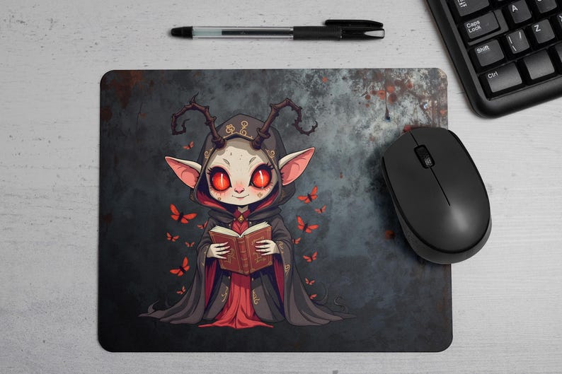 Dark chibi witch mouse pad featuring a cute demon girl with glowing red eyes, gothic robes, and ancient spellbook. This high-resolution PNG design is perfect for gaming setups, horror-themed desks, occult lovers, and digital art fans. The creepy yet adorable aesthetic makes it an ideal pick for gothic decor, fantasy enthusiasts, and witchcraft-inspired designs.