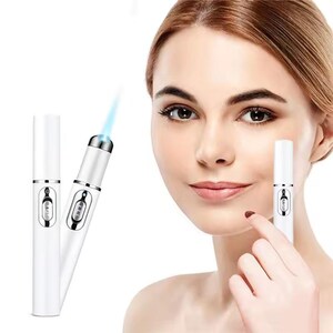 May include: White beauty device with a blue light emitting from the tip. The device has a silver button and a small screen. A woman is holding one of the devices near her eye. The device is designed for skincare.
