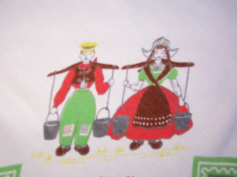 yellow and orange rectangle tablecloth tulips and adorable dutch boy and girl.In green vintage tablecloth all about Holland with windmills