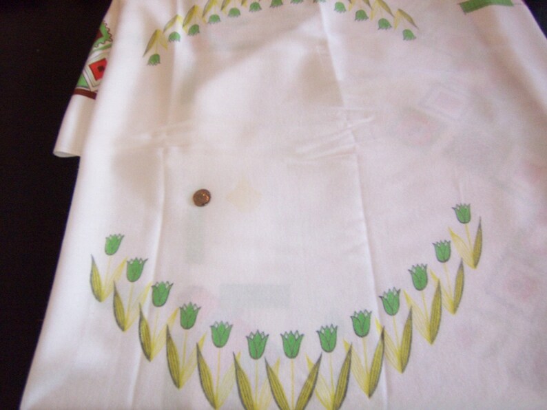 yellow and orange rectangle tablecloth tulips and adorable dutch boy and girl.In green vintage tablecloth all about Holland with windmills