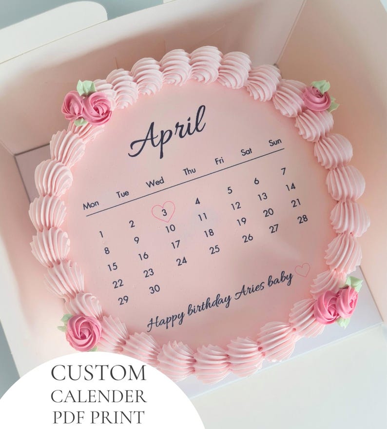 May include: A pink cake decorated with pink frosting and pink roses. The cake is designed as an April calendar with the text "Happy birthday Aries baby." The cake is in a white box, with the text "CUSTOM CALENDER PDF PRINT" at the bottom.