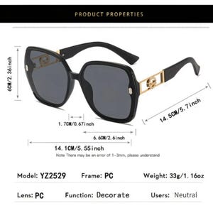 May include: Black sunglasses with a square frame and dark lenses. The sunglasses have gold-colored accents on the temples and frame. The frame is 5.55 inches wide and 2.36 inches high. Model YZ2529. Weight 1.16 oz.