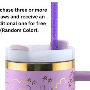 May include: A close-up of a lavender tumbler with a gold band and a purple handle. A purple glitter straw is inserted into the lid. The tumbler has a white lid and gold accents. The text on the image says "Purchase three or more straws and receive an additional one for free (Random Color)."