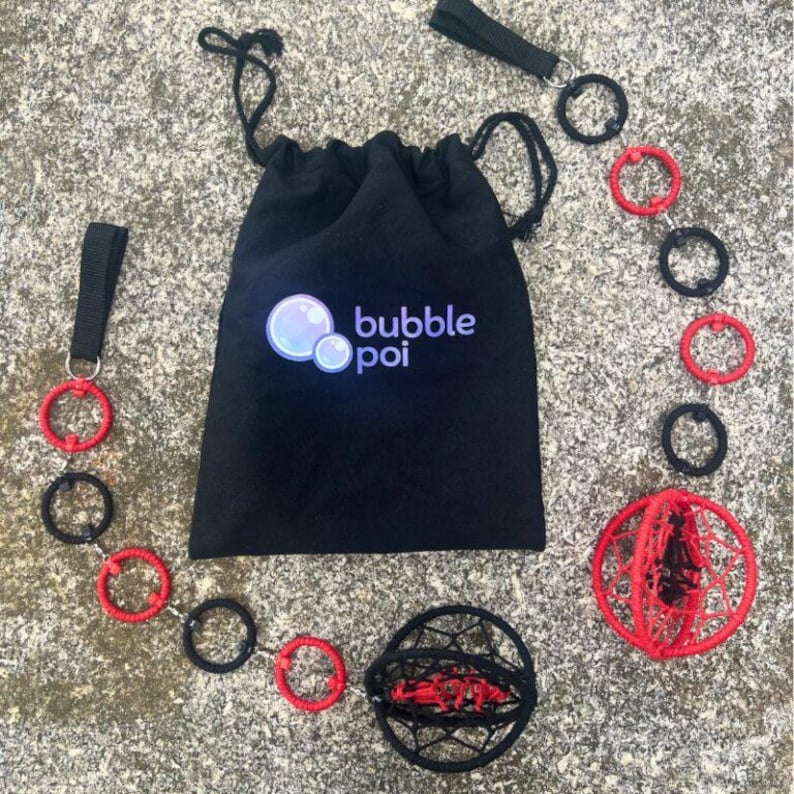 May include: A black drawstring bag with the text bubble poi printed in white and blue, accompanied by two poi sets featuring red and black rings connected by chains, ending in spherical cages with red and black woven patterns for performance.