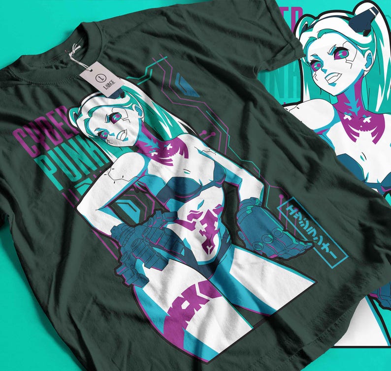 May include: Dark green t-shirt with a futuristic anime-style illustration of a female character with teal hair and accents. The shirt has the words "CYBER PUNK" in a purple and teal font. A tag on the shirt reads "LARGE".
