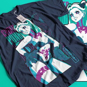 May include: Dark blue t-shirt with a graphic of a female anime character with teal hair and accents. The shirt has the words "CYBER PUNK" printed in teal and pink. A tag is attached to the shirt.