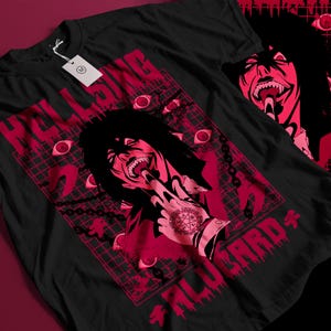 May include: Black t-shirt featuring a red graphic design with the text "HELLSING" and "ALUCARD". The design includes a stylized illustration of a character with long black hair, surrounded by red eyes and chains.
