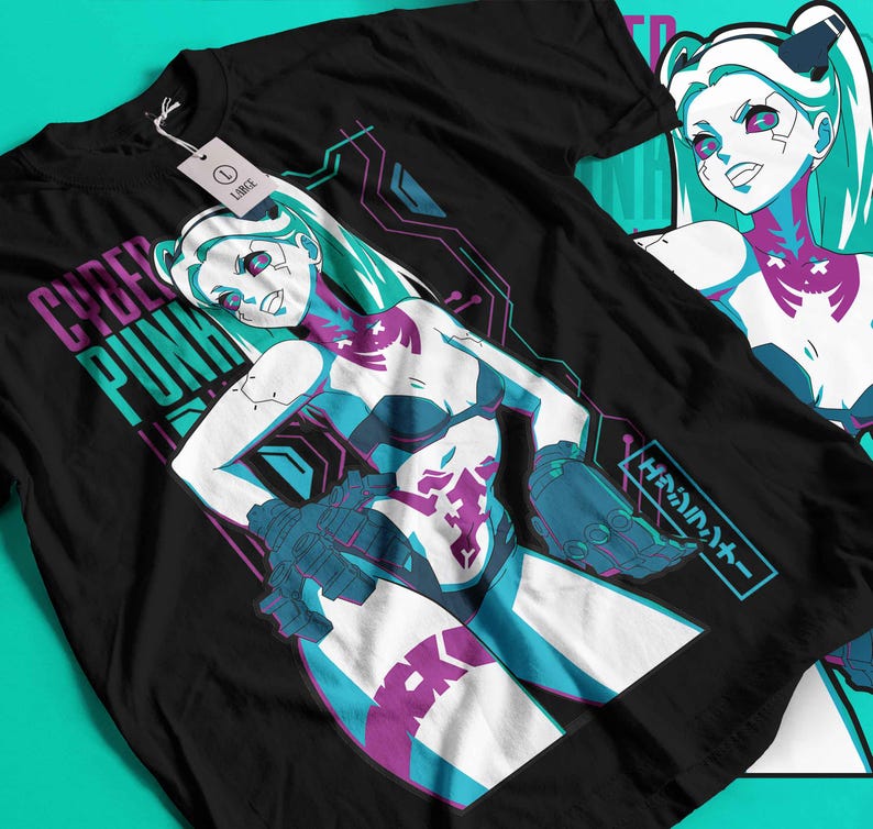 May include: Black t-shirt with a vibrant anime-style illustration of a female character with teal hair and accents. The shirt features the words "CYBER PUNK" in teal and purple, Japanese text, and circuit board-like graphics.