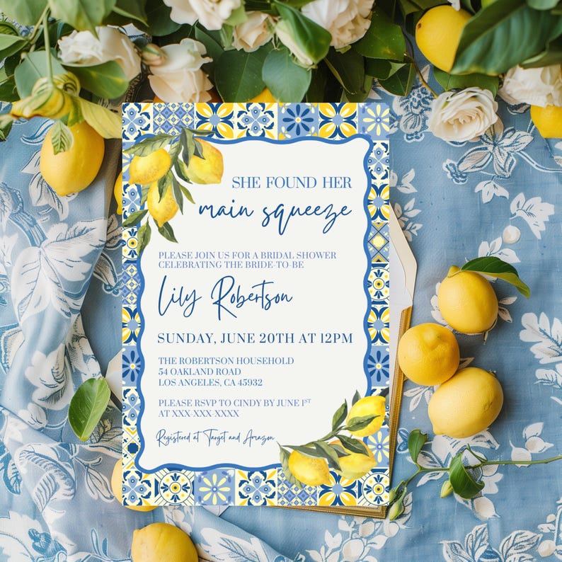 May include: Bridal shower invitation with a lemon theme. The invitation has a blue and yellow tile design with lemon illustrations. Text reads "She found her main squeeze" and details for the event.