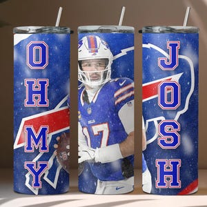 May include: Three stainless steel tumblers with a blue and white design featuring a football player wearing a blue jersey with the number 17. The tumblers have the letters "OHMY" on the left, "JOSH" on the right, and a football player on the middle tumbler.