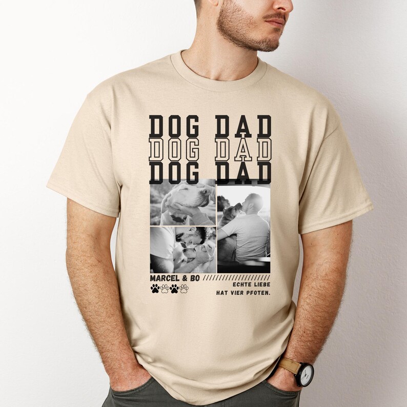 May include: Beige t-shirt with the words "DOG DAD" in a stacked design. Below are four black and white photos of dogs and people. The text "MARCEL & BO" and "ECHTE LIEBE HAT VIER PFOTEN" are also printed on the shirt.