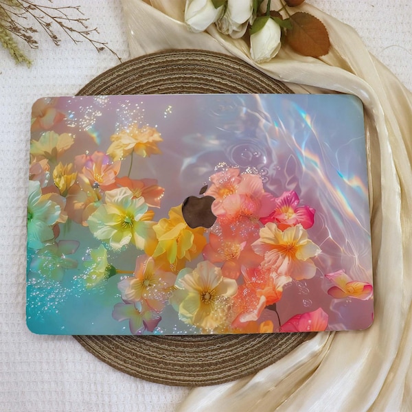 May include: A laptop skin featuring a design of pastel pink, yellow, and white flowers submerged in water with a holographic iridescent effect.