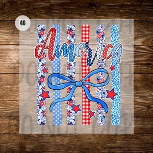 May include: A design with the word "America" in red and blue script, and a blue bow. The background has vertical stripes in red gingham, blue stars, and floral patterns. Red stars are scattered around the design, evoking a patriotic theme.