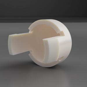 Op de afbeelding: Een rond wit keramiek object met drie secties. Het object heeft een gladde, glanzende afwerking.