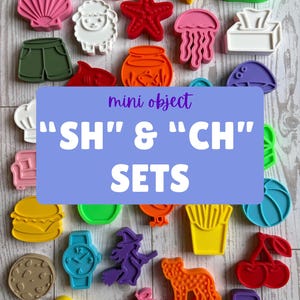 May include: A collection of colorful plastic mini object shapes including a fish, shell, sheep, starfish, jellyfish, tissue box, shorts, fishbowl, whale, burger, watch, witch, fries, cherry, cheese, peach, and chair with text reading mini object SH & CH SETS.