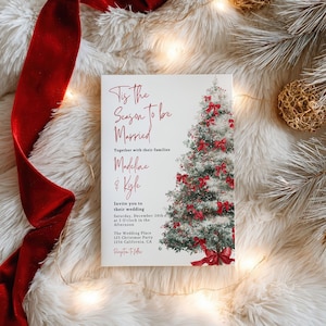 May include: A wedding invitation with the text "Tis the Season to be Married" and the names Madeline & Kyle. The invitation features a Christmas tree decorated with red bows. The invitation is on a white background.