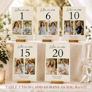 May include: Five rectangular cream-colored table number cards featuring the text When we were, a large number, and two side-by-side photographs of children or young adults. Each card includes the names Tricia & Kyle and the date 10.25.20XX.