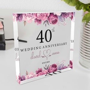 May include: A clear acrylic block with a floral design and the text "40th Wedding Anniversary David & Anna 07.07.2024".