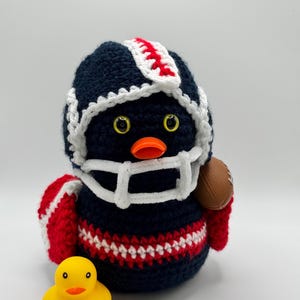 May include: A handmade wooden sign with the text "Welcome" in a playful, handwritten font. The sign is painted white with a distressed finish, and a small, decorative heart is attached. It's designed for indoor or outdoor use.