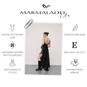 May include: A woman wearing a black satin maxi dress with lace detailing and a high slit. The dress has spaghetti straps and is paired with black boots. The image includes the text "MARMALADEE" and "BODYSUITS FOR ANY LOOK".
