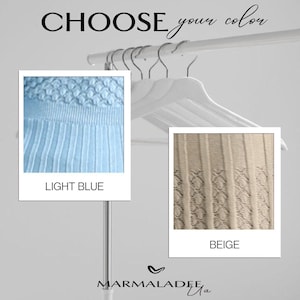 May include: Image featuring two fabric swatches, one light blue and one beige, displayed on a clothing rack. The text "CHOOSE your color" is at the top. The light blue swatch is labeled "LIGHT BLUE" and the beige swatch is labeled "BEIGE".