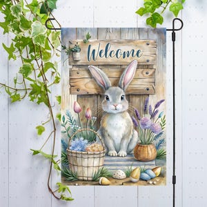 May include: A welcome garden flag featuring a white bunny rabbit, purple flowers, and a wooden sign that reads "Welcome".