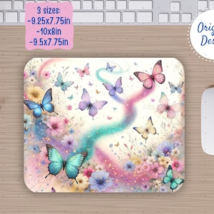 May include: A rectangular mousepad with a colorful butterfly design. The pad features butterflies in shades of blue, pink, and purple, with a floral background. The mousepad is available in three sizes: 9.25x7.75in, 10x8in, and 9.5x7.75in.