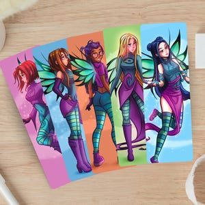 May include: A set of three ceramic mugs with a speckled, matte finish. The mugs are in shades of cream, light gray, and dark gray. Each mug has a simple, minimalist design, perfect for coffee or tea.