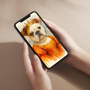 May include: A smartphone displays a watercolor painting of a regal bulldog wearing a gold crown and an orange dress. The dog has a pearl necklace. The background is a light blue and beige wash. The phone is held in two hands.