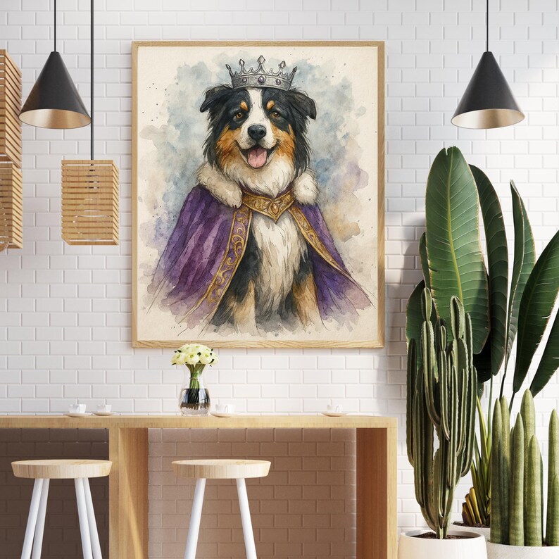 May include: Watercolor painting of a dog wearing a crown and royal purple cape with gold trim. The dog has black, white, and brown fur and is smiling. The artwork is framed in a light wood frame.