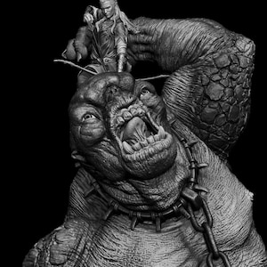 May include: A monochrome sculpture depicting a fantasy scene. A warrior with long hair stands on a monstrous creature with a gaping mouth and chained collar. The creature has a large, textured arm.
